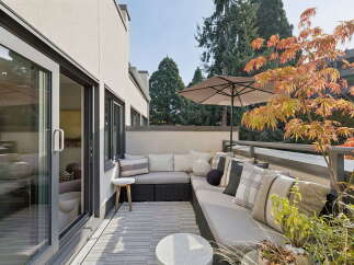 Enjoy outdoor living on this spacious balcony, perfect for entertaining or relaxing.