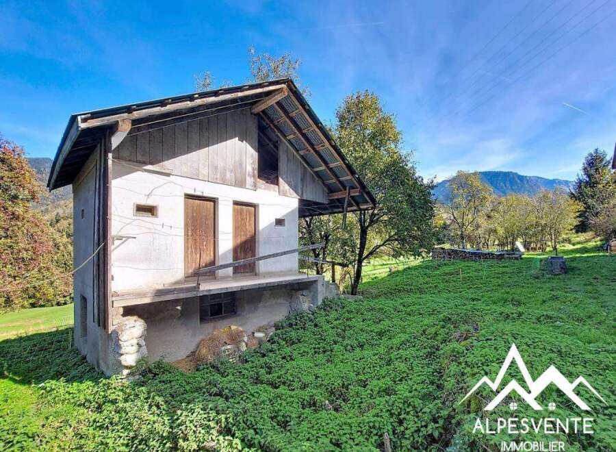 Discover this charming property nestled in a serene mountain landscape.
