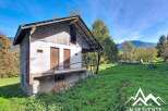 Discover this charming property nestled in a serene mountain landscape.