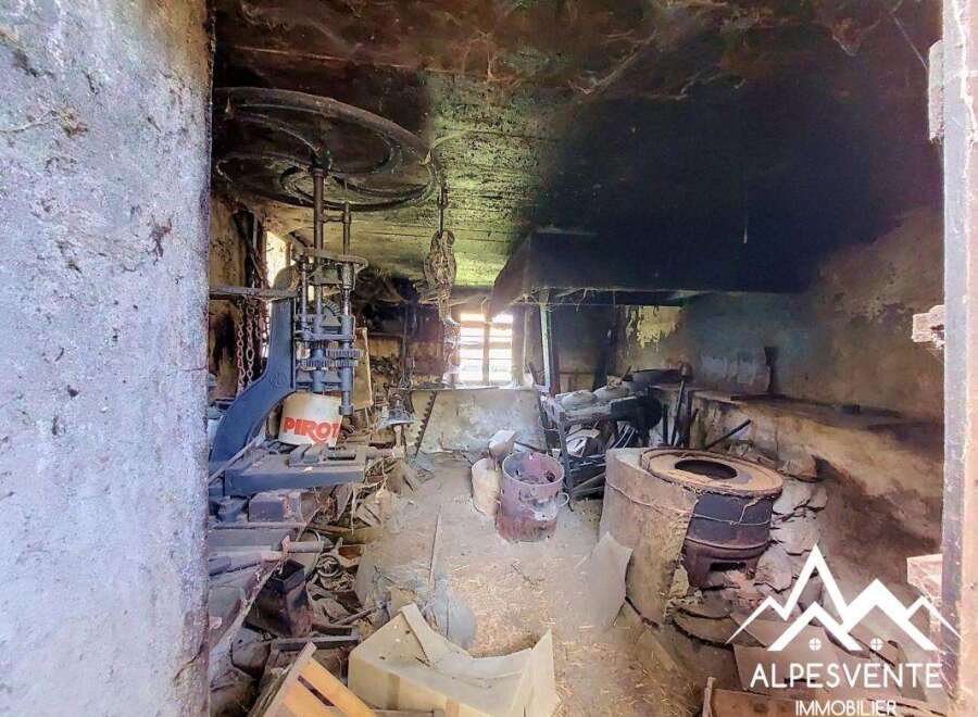Discover a unique opportunity to own a piece of history with this rustic property, featuring original industrial machinery and a charming, untouched interior.
