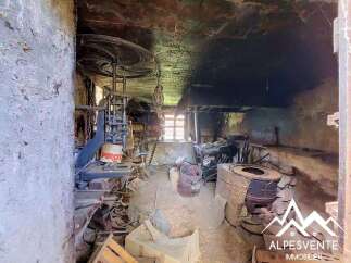 Discover a unique opportunity to own a piece of history with this rustic property, featuring original industrial machinery and a charming, untouched interior.