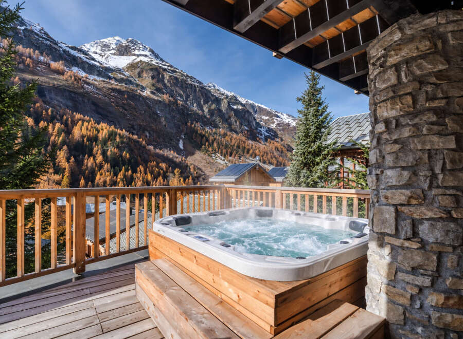 Experience ultimate relaxation with this luxurious hot tub, perfectly situated on a private balcony with breathtaking mountain views.