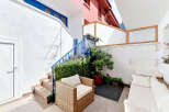 Discover this charming outdoor seating area, perfect for relaxation and entertaining.