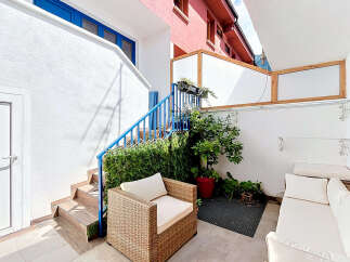 Discover this charming outdoor seating area, perfect for relaxation and entertaining.