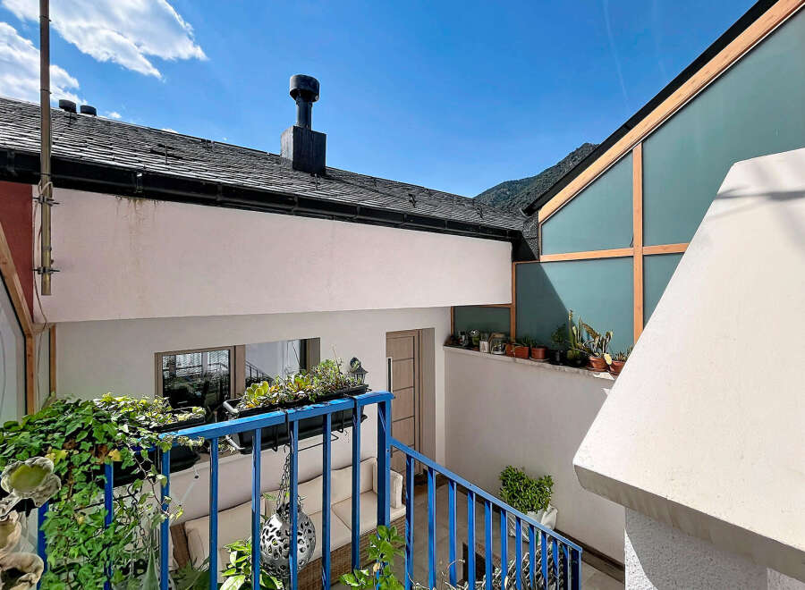 Discover this charming property featuring a modern architectural design with a striking angled glass facade.