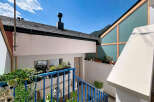 Discover this charming property featuring a modern architectural design with a striking angled glass facade.
