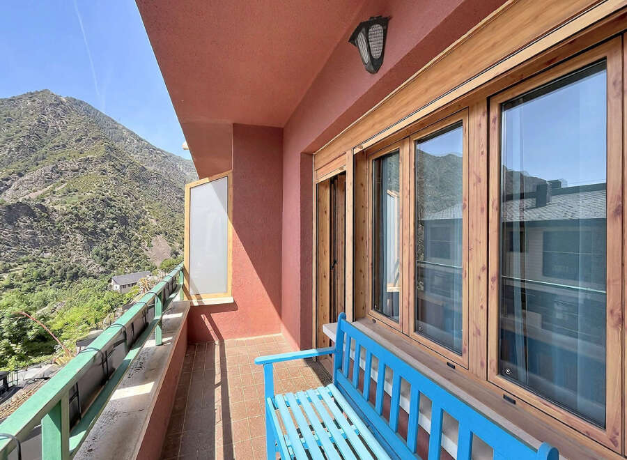 Enjoy breathtaking mountain views from this charming balcony, perfect for a morning coffee or evening relaxation.