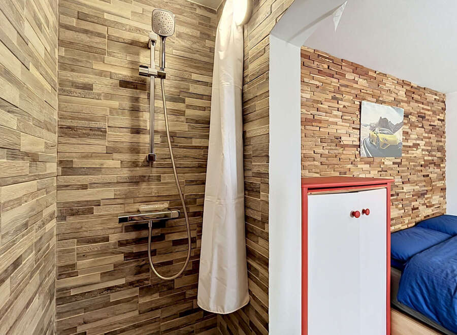 Experience a unique blend of rustic charm and modern convenience in this distinctive living space.