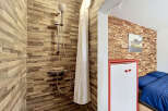 Experience a unique blend of rustic charm and modern convenience in this distinctive living space.