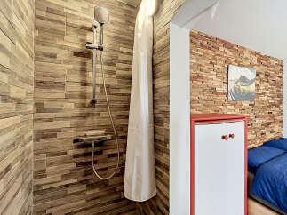 Experience a unique blend of rustic charm and modern convenience in this distinctive living space.