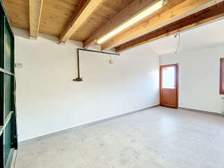 Discover this spacious, unfinished room, perfect for customization.