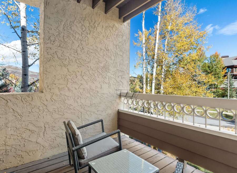 Enjoy the crisp autumn air from this charming balcony, perfect for morning coffee or evening relaxation.