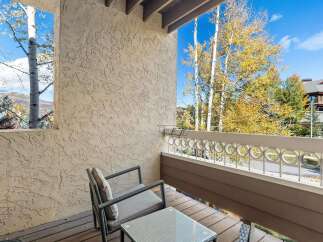 Enjoy the crisp autumn air from this charming balcony, perfect for morning coffee or evening relaxation.