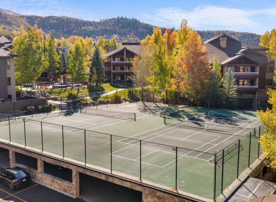 Enjoy outdoor recreation with this stunning tennis court, perfect for a friendly match or practice.