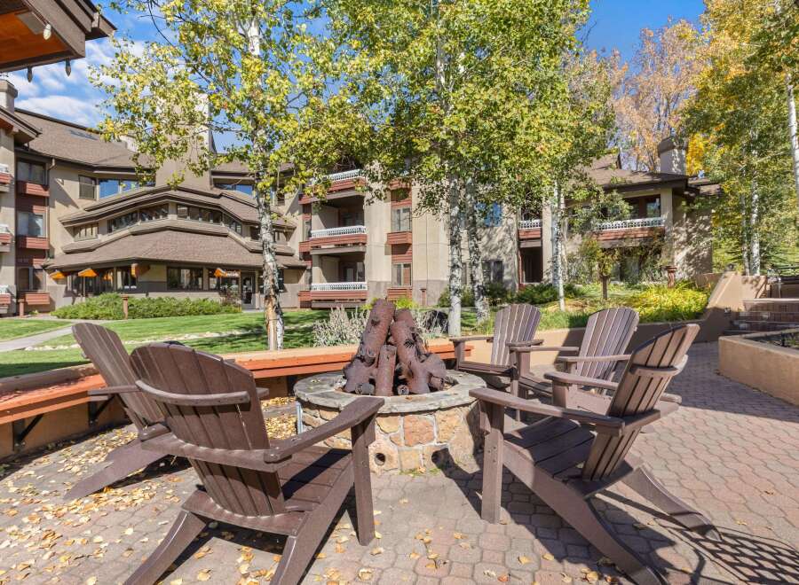 Enjoy cozy evenings around the fire pit, surrounded by the vibrant autumn foliage.