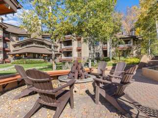 Enjoy cozy evenings around the fire pit, surrounded by the vibrant autumn foliage.
