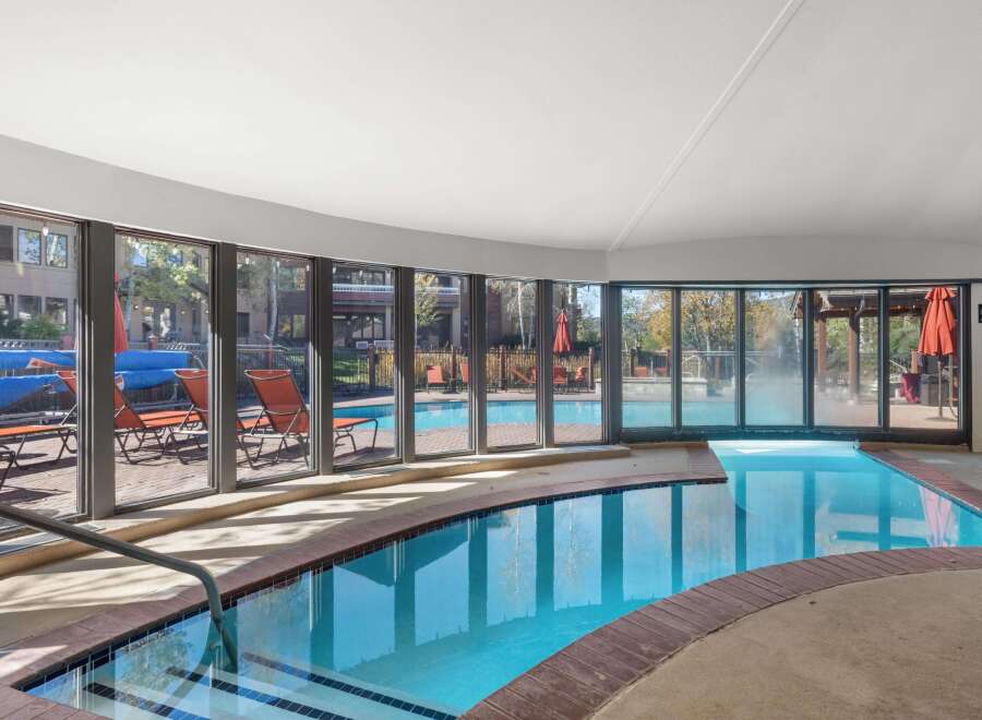 Enjoy a refreshing dip in this indoor swimming pool, complete with a relaxing hot tub.