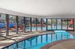 Enjoy a refreshing dip in this indoor swimming pool, complete with a relaxing hot tub.