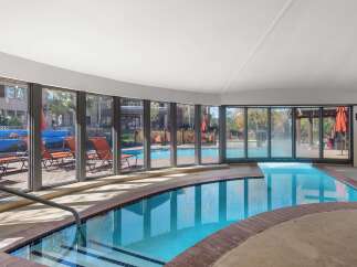 Enjoy a refreshing dip in this indoor swimming pool, complete with a relaxing hot tub.