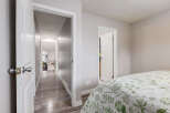Step into a bright and airy hallway leading to multiple rooms, perfect for a growing family or hosting guests.