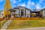 This charming home features a spacious wooden deck perfect for outdoor entertaining, complete with a covered gazebo.