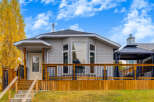 Charming single-family home featuring a spacious wooden deck perfect for outdoor entertaining.