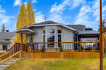 This charming home features a spacious wooden deck perfect for outdoor entertaining, complete with a covered gazebo.