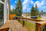 Enjoy outdoor living on this spacious wooden deck, perfect for entertaining or relaxing.