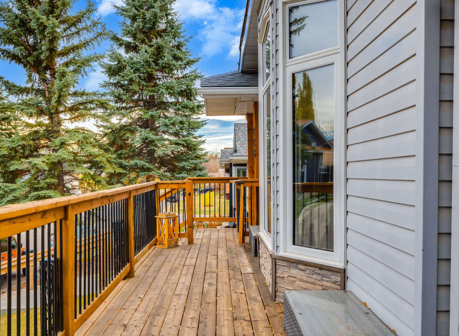 Enjoy the outdoors from this spacious wooden deck, perfect for entertaining or relaxing.