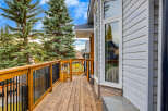 Enjoy the outdoors from this spacious wooden deck, perfect for entertaining or relaxing.