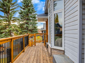 Enjoy the outdoors from this spacious wooden deck, perfect for entertaining or relaxing.