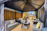 Enjoy outdoor living in this spacious covered patio, perfect for entertaining or relaxing.