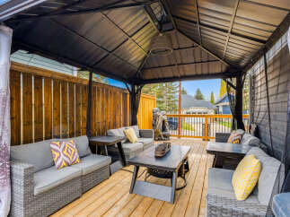 Enjoy outdoor living in this spacious covered patio, perfect for entertaining or relaxing.