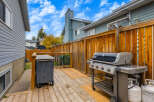 Enjoy outdoor living on this spacious wooden deck, perfect for entertaining.