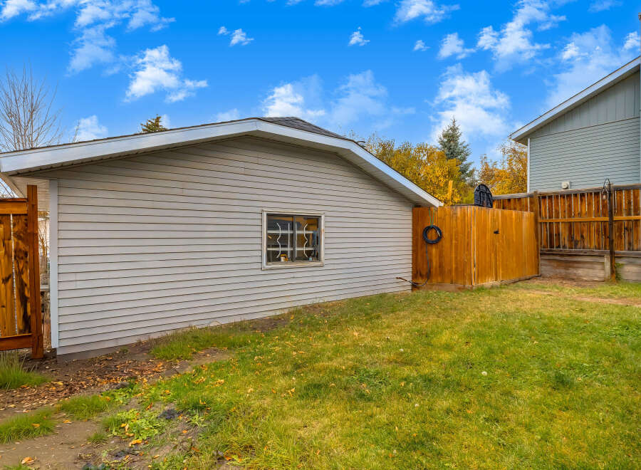 Discover this charming property featuring a well-maintained garage with a single window, perfect for storage or a workshop.