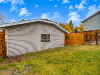 Discover this charming property featuring a well-maintained garage with a single window, perfect for storage or a workshop.