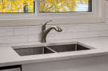 Experience the beauty of autumn from your kitchen with this stunning view through the window.