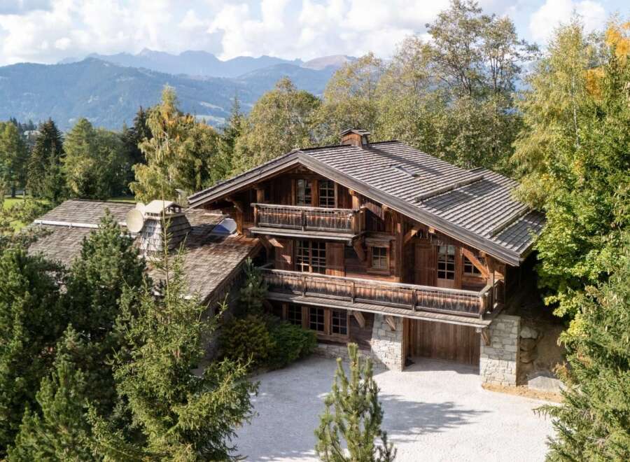 Experience luxury mountain living in this stunning wooden chalet, nestled amidst lush greenery and breathtaking mountain vistas.