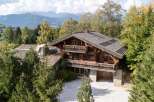 Experience luxury mountain living in this stunning wooden chalet, nestled amidst lush greenery and breathtaking mountain vistas.