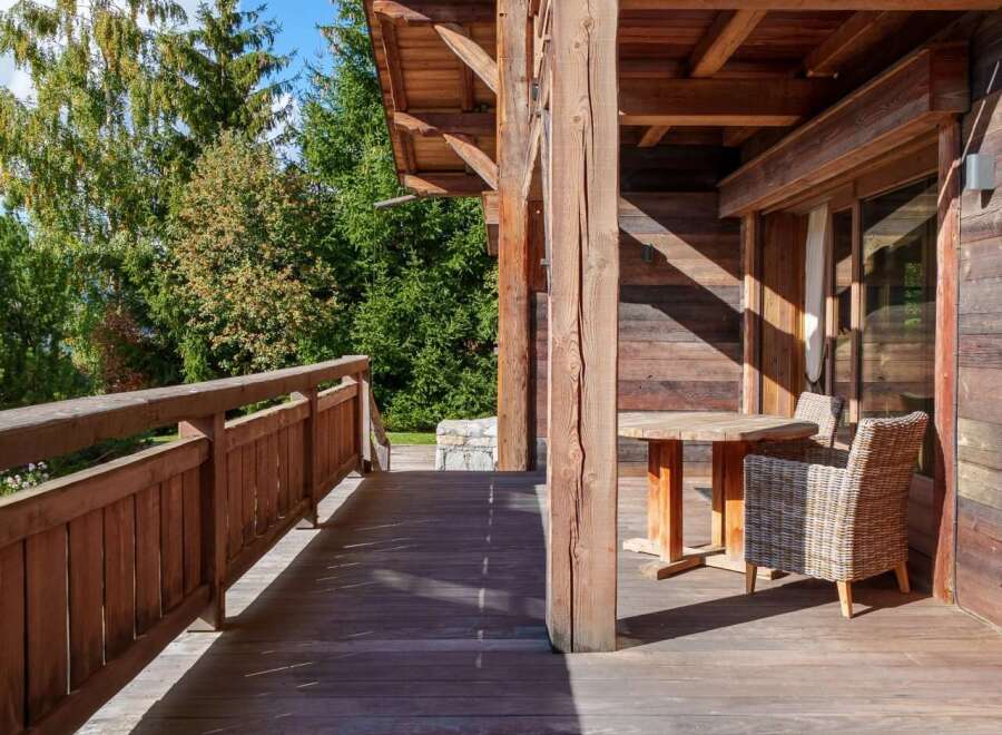 Experience the charm of this rustic wooden cabin, featuring a spacious deck perfect for enjoying the surrounding nature.