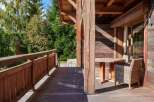 Experience the charm of this rustic wooden cabin, featuring a spacious deck perfect for enjoying the surrounding nature.