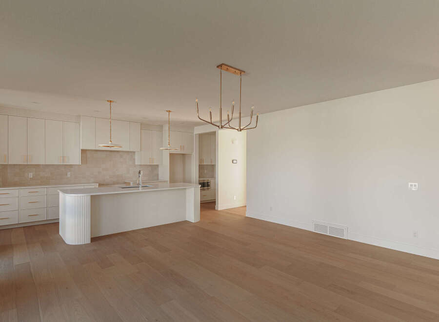 Experience modern living in this stunning open-concept kitchen and dining area.