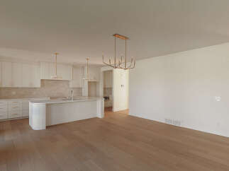 Experience modern living in this stunning open-concept kitchen and dining area.
