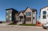 Experience modern luxury in this stunning new construction home, featuring a striking architectural design with a blend of brick and contemporary siding.