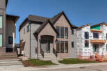 Discover modern living in this stunning new construction home, featuring a striking combination of light brick and sleek grey siding.