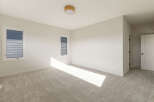 Step into this bright and airy bedroom, featuring plush carpeting that adds warmth and comfort.