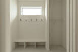 This mudroom features a built-in bench with storage cubbies, perfect for organizing shoes and bags.