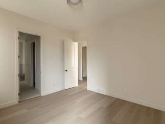 Step into this bright and airy bedroom, featuring a neutral color palette that creates a serene atmosphere.
