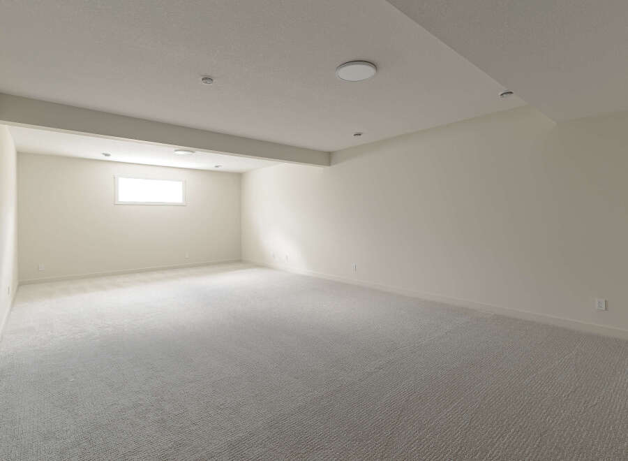 This spacious, unfinished basement offers a blank canvas for your dream home.