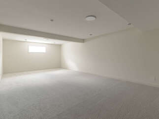 This spacious, unfinished basement offers a blank canvas for your dream home.